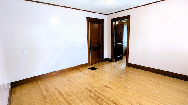 191 Bates St, Pittsfield, ME 04967 - empty room with light wood-style flooring and ornamental molding