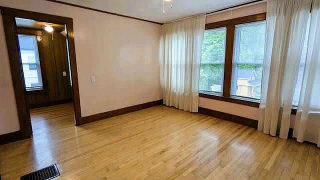 191 Bates St, Pittsfield, ME 04967 - spare room with light wood-style floors, healthy amount of natural light, and ornamental molding