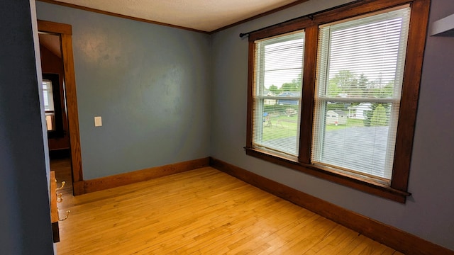 191 Bates St, Pittsfield, ME 04967 - spare room with crown molding and light wood-style floors