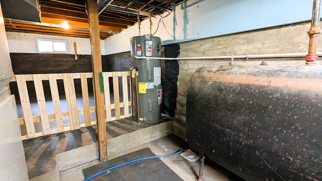 191 Bates St, Pittsfield, ME 04967 - basement with oil tank and hybrid water heater