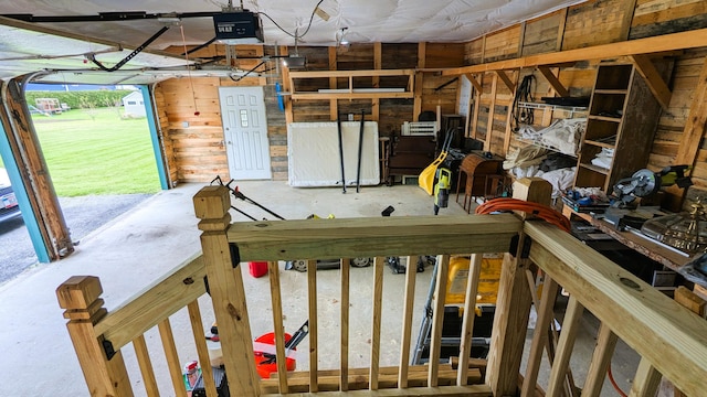 191 Bates St, Pittsfield, ME 04967 - garage with a garage door opener and wooden walls