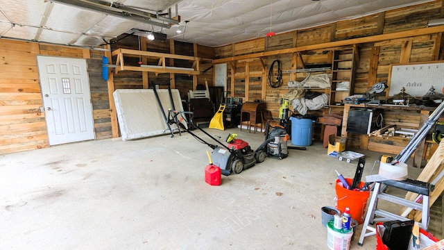 191 Bates St, Pittsfield, ME 04967 - garage with a garage door opener and wooden walls