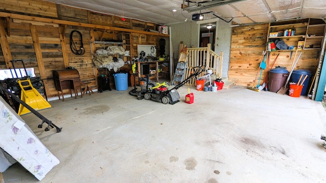 191 Bates St, Pittsfield, ME 04967 - garage with a garage door opener and wood walls