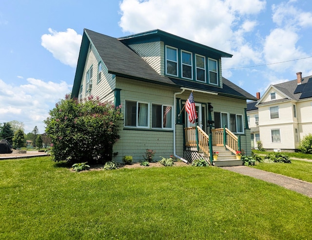 191 Bates St, Pittsfield, ME 04967 - bungalow-style home with a front lawn and a shingled roof