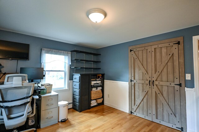 77 Carter St, Portland, ME 04103 - office area featuring a wainscoted wall, light wood-style flooring, and a baseboard radiator