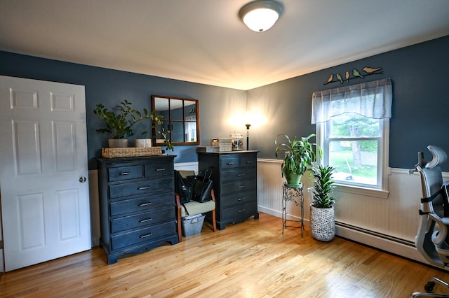 77 Carter St, Portland, ME 04103 - home office featuring wainscoting, light wood finished floors, and a baseboard radiator