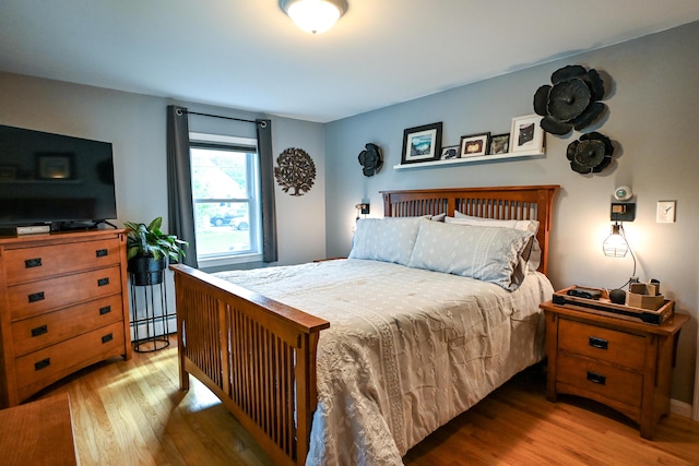 77 Carter St, Portland, ME 04103 - bedroom featuring light wood finished floors and a baseboard heating unit
