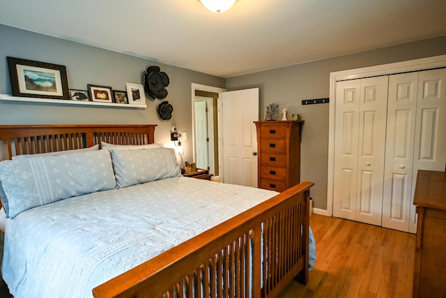 77 Carter St, Portland, ME 04103 - bedroom with wood finished floors, a closet, and baseboards
