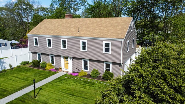 77 Carter St, Portland, ME 04103 - colonial house with a chimney and roof with shingles