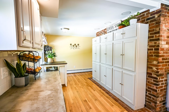 77 Carter St, Portland, ME 04103 - hall featuring baseboard heating and light wood-style flooring