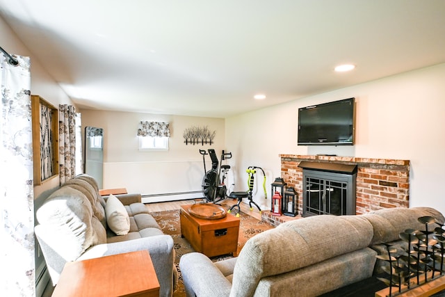 77 Carter St, Portland, ME 04103 - living area featuring a baseboard radiator, wood finished floors, a brick fireplace, a baseboard heating unit, and recessed lighting