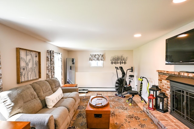 77 Carter St, Portland, ME 04103 - living room featuring recessed lighting, a fireplace, a baseboard heating unit, and wood finished floors