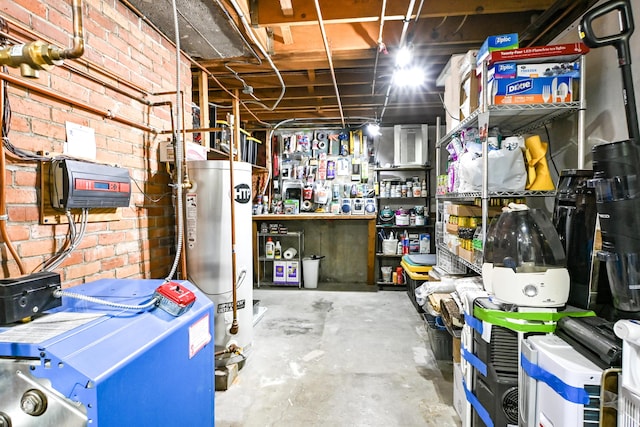 77 Carter St, Portland, ME 04103 - unfinished below grade area with gas water heater, a heating unit, and brick wall