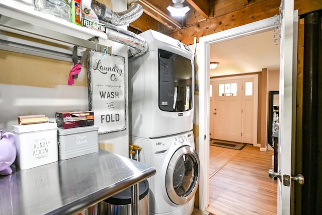 77 Carter St, Portland, ME 04103 - laundry room with stacked washer / drying machine and wood finished floors
