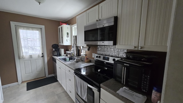 2 Fairview Ave, Houlton, ME 04730 - kitchen with appliances with stainless steel finishes, a sink, white cabinets, and baseboards
