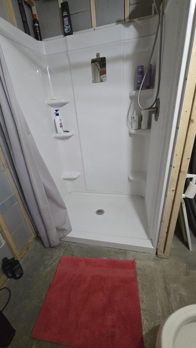 2 Fairview Ave, Houlton, ME 04730 - bathroom featuring a shower stall and unfinished concrete floors