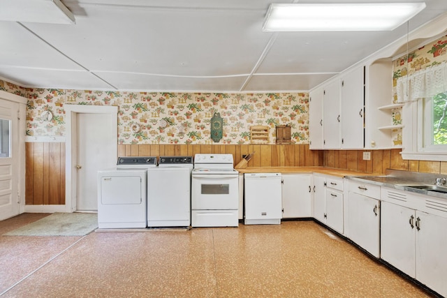 26 Unity Rd, Albion, ME 04910 - kitchen featuring wallpapered walls, white appliances, separate washer and dryer, wainscoting, and white cabinetry
