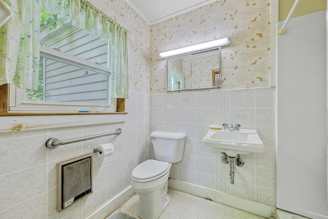 26 Unity Rd, Albion, ME 04910 - bathroom featuring toilet, a wainscoted wall, ornamental molding, heating unit, and wallpapered walls