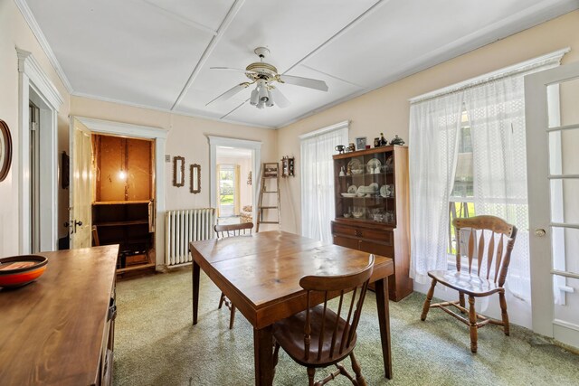 26 Unity Rd, Albion, ME 04910 - carpeted dining area with radiator heating unit, a ceiling fan, and crown molding