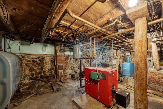 26 Unity Rd, Albion, ME 04910 - unfinished below grade area with oil tank, a heating unit, and a water pressure tank