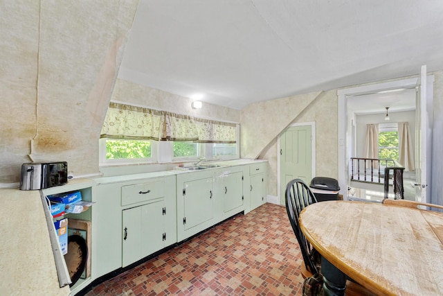 26 Unity Rd, Albion, ME 04910 - kitchen featuring brick patterned flooring, light countertops, and a sink