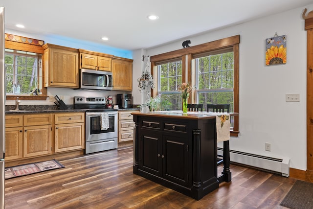2 Ball Park Rd, Lewiston, ME 04240 - kitchen with stainless steel appliances, baseboard heating, recessed lighting, dark wood finished floors, and dark cabinetry