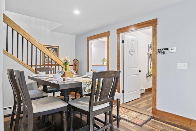 2 Ball Park Rd, Lewiston, ME 04240 - dining space with wood finished floors, a baseboard radiator, recessed lighting, stairs, and baseboards