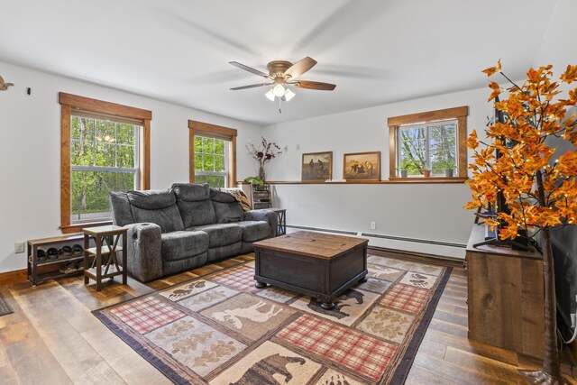 2 Ball Park Rd, Lewiston, ME 04240 - living room with a baseboard radiator, ceiling fan, and wood finished floors
