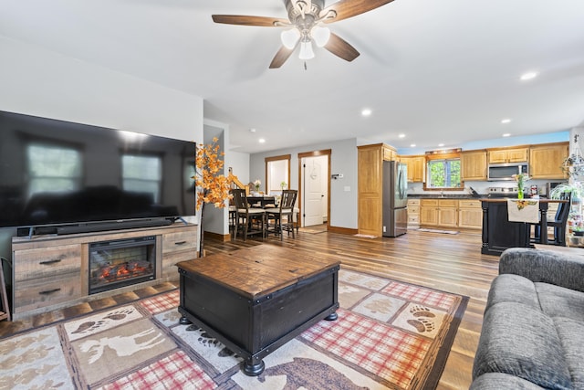 2 Ball Park Rd, Lewiston, ME 04240 - living area with light wood-type flooring, a ceiling fan, recessed lighting, baseboards, and a tiled fireplace