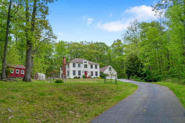 3 Payneton Hill Rd, York, ME 03909 - colonial inspired home featuring an outdoor structure, a chimney, a front lawn, and driveway