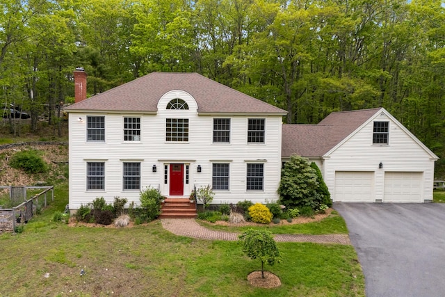 3 Payneton Hill Rd, York, ME 03909 - colonial inspired home featuring a chimney, asphalt driveway, a front lawn, and roof with shingles