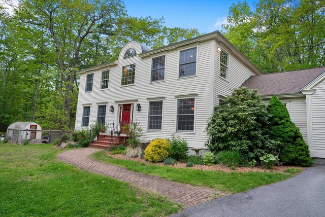 3 Payneton Hill Rd, York, ME 03909 - colonial-style house featuring a front lawn, an outdoor structure, and a greenhouse