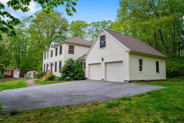 3 Payneton Hill Rd, York, ME 03909 - view of front of house with driveway, roof with shingles, and a front lawn