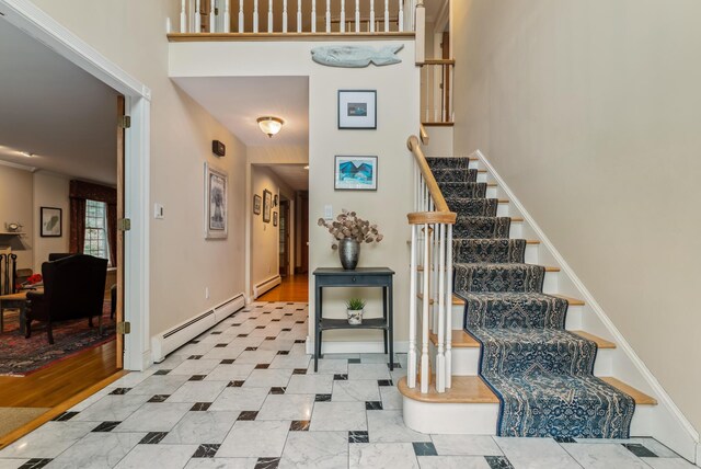 3 Payneton Hill Rd, York, ME 03909 - stairway featuring baseboard heating, a baseboard heating unit, and a towering ceiling