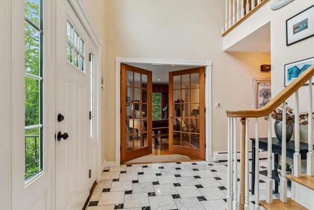 3 Payneton Hill Rd, York, ME 03909 - entrance foyer featuring a towering ceiling, plenty of natural light, french doors, baseboards, and stairway