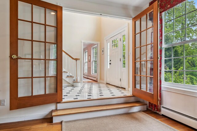 3 Payneton Hill Rd, York, ME 03909 - entrance foyer featuring a baseboard heating unit, stairway, and plenty of natural light