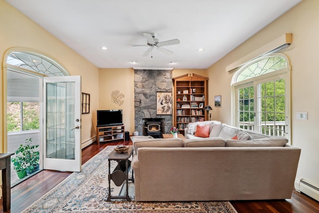 3 Payneton Hill Rd, York, ME 03909 - living room featuring a baseboard radiator, a wood stove, dark wood-style floors, ceiling fan, and recessed lighting