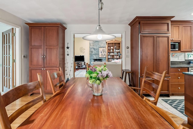 3 Payneton Hill Rd, York, ME 03909 - dining area featuring light tile patterned floors and a stone fireplace