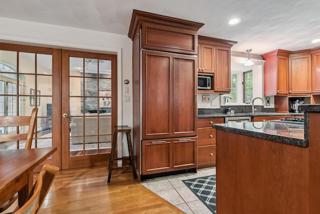 3 Payneton Hill Rd, York, ME 03909 - kitchen featuring stainless steel microwave, paneled fridge, dark stone countertops, recessed lighting, and a sink