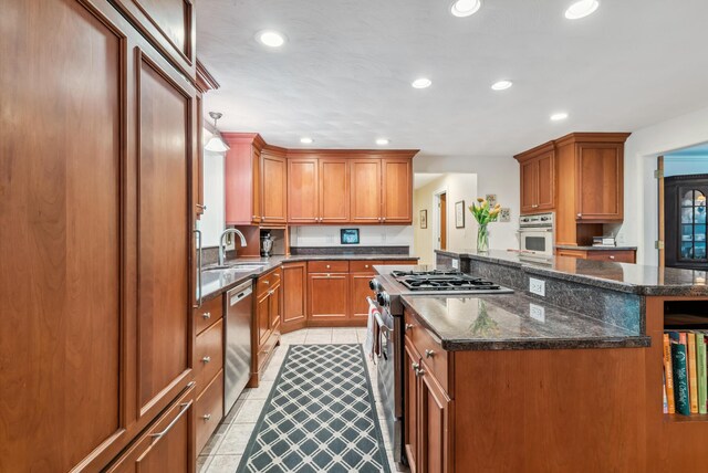 3 Payneton Hill Rd, York, ME 03909 - kitchen featuring stainless steel appliances, light tile patterned flooring, a kitchen island, brown cabinets, and recessed lighting
