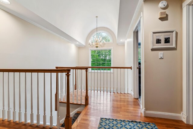 3 Payneton Hill Rd, York, ME 03909 - hall featuring wood finished floors, a chandelier, lofted ceiling, baseboards, and an upstairs landing