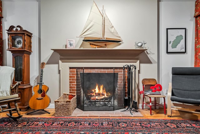 3 Payneton Hill Rd, York, ME 03909 - living area with a brick fireplace and wood finished floors