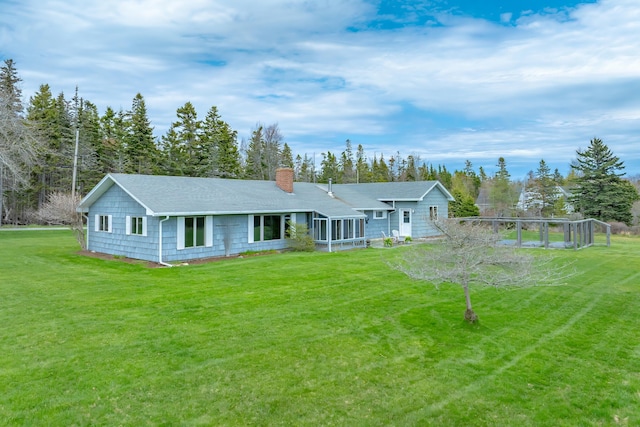 4 Seawall Point Ln, Southwest Harbor, ME 04679 - view of front of house featuring a sunroom, a chimney, and a front lawn