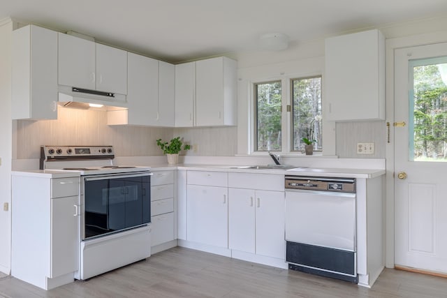 4 Seawall Point Ln, Southwest Harbor, ME 04679 - kitchen featuring white appliances, under cabinet range hood, a sink, light countertops, and light wood finished floors