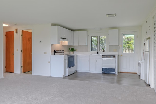 4 Seawall Point Ln, Southwest Harbor, ME 04679 - kitchen featuring white appliances, exhaust hood, a sink, light countertops, and white cabinetry