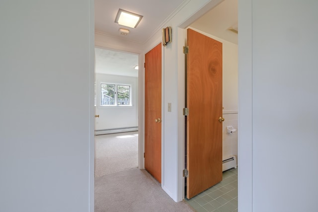 4 Seawall Point Ln, Southwest Harbor, ME 04679 - hall featuring baseboard heating, light tile patterned floors, and crown molding