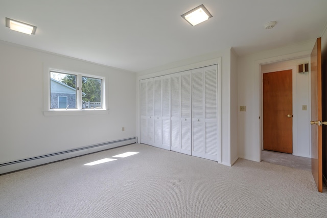 4 Seawall Point Ln, Southwest Harbor, ME 04679 - unfurnished bedroom with light carpet, a closet, and baseboard heating