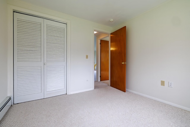 4 Seawall Point Ln, Southwest Harbor, ME 04679 - unfurnished bedroom featuring baseboard heating, a closet, carpet, and baseboards