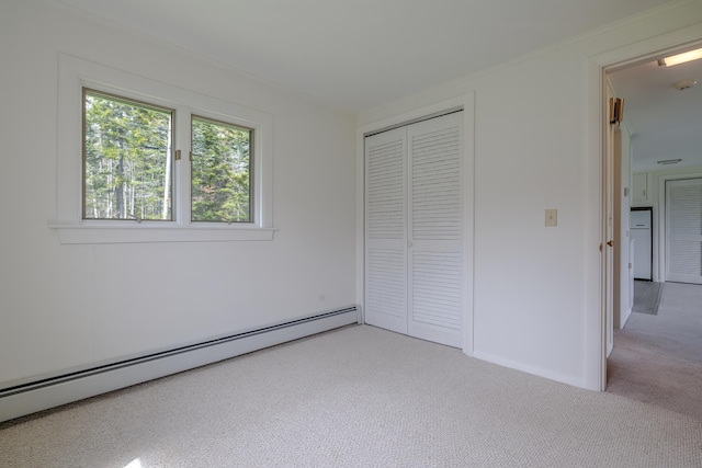 4 Seawall Point Ln, Southwest Harbor, ME 04679 - unfurnished bedroom with a baseboard radiator, light colored carpet, and a closet