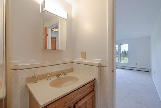 4 Seawall Point Ln, Southwest Harbor, ME 04679 - bathroom featuring baseboard heating, vanity, tile walls, and a wainscoted wall